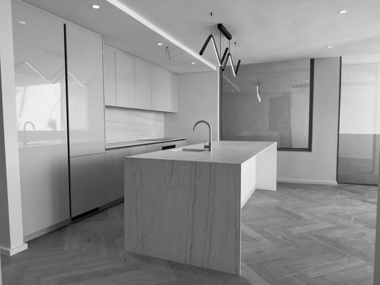 Modern kitchen with overhead cabinetry and worktop
