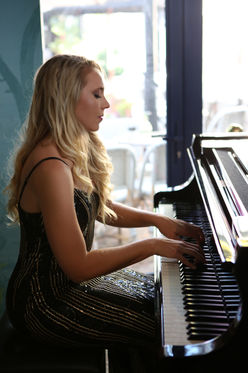 Melorie Jane specializes in solo piano-and-singing performances as well as leading various ensembles. Additionally, I run a booking company that provides live music for events and functions. My repertoire covers a wide range of light jazz, popular covers, and South African jazz.