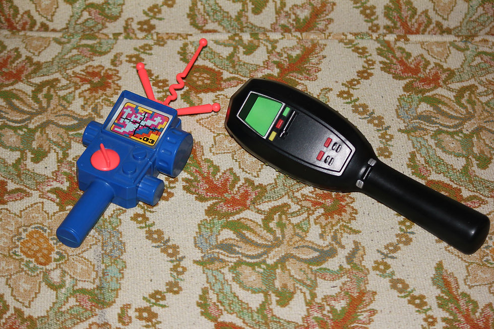 Kenner and Spirit Halloween Ghostbusters PKE meters.