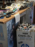 Box of movie posters for sale.