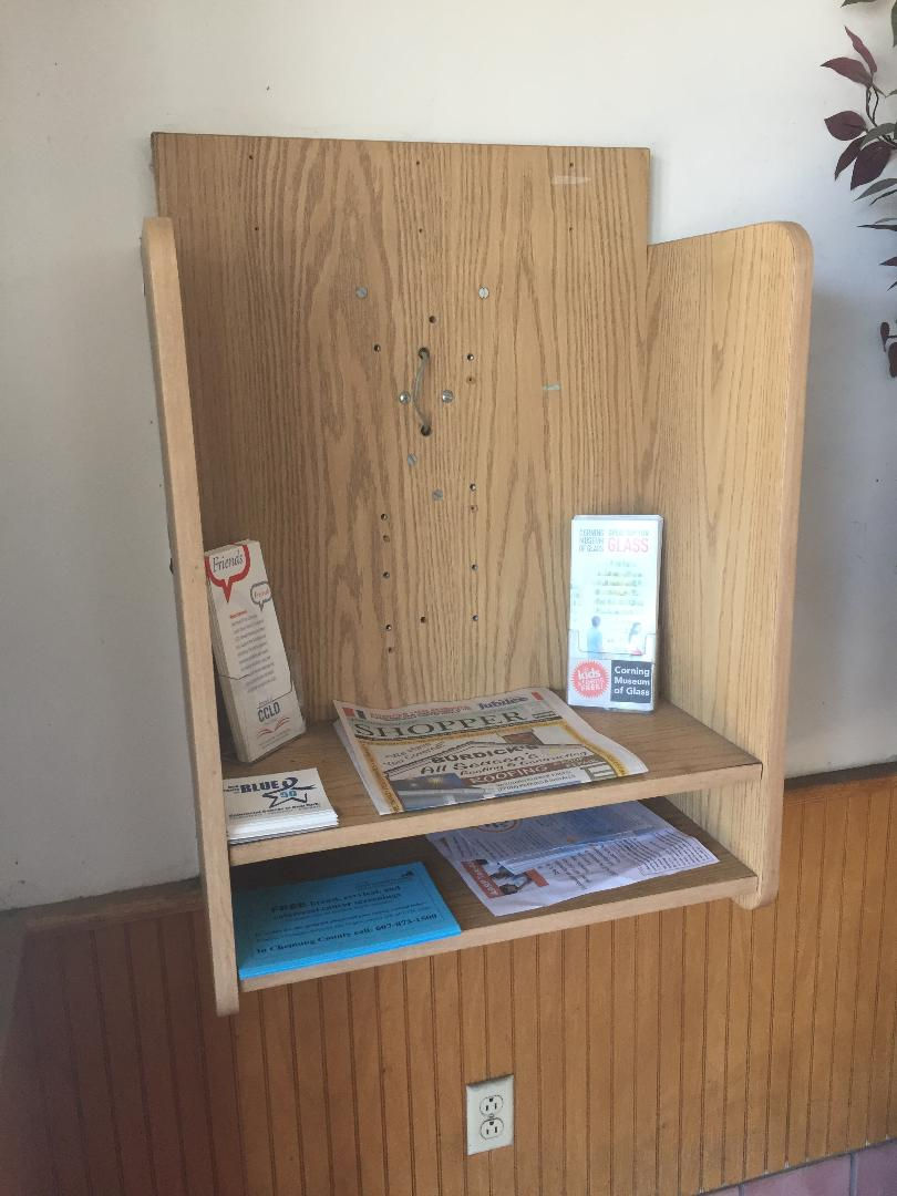 Payphone kiosk in a coffee shop.