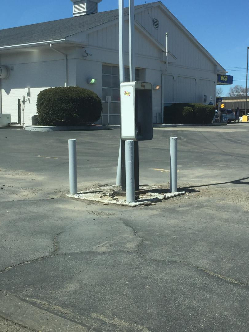 Empty payphone kiosk.