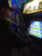 Man playing Root Beer Tapper at Robot City Games, Binghamton, NY