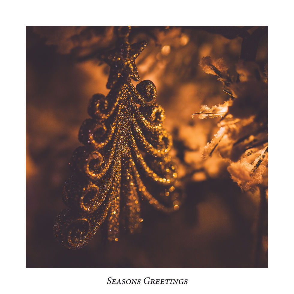 Handmade Christmas Card with Christmas bauble decoration on design. Captioned 'Seasons Greetings'