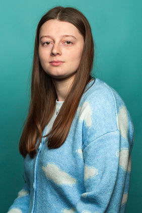 Studio portrait in monochrome blue