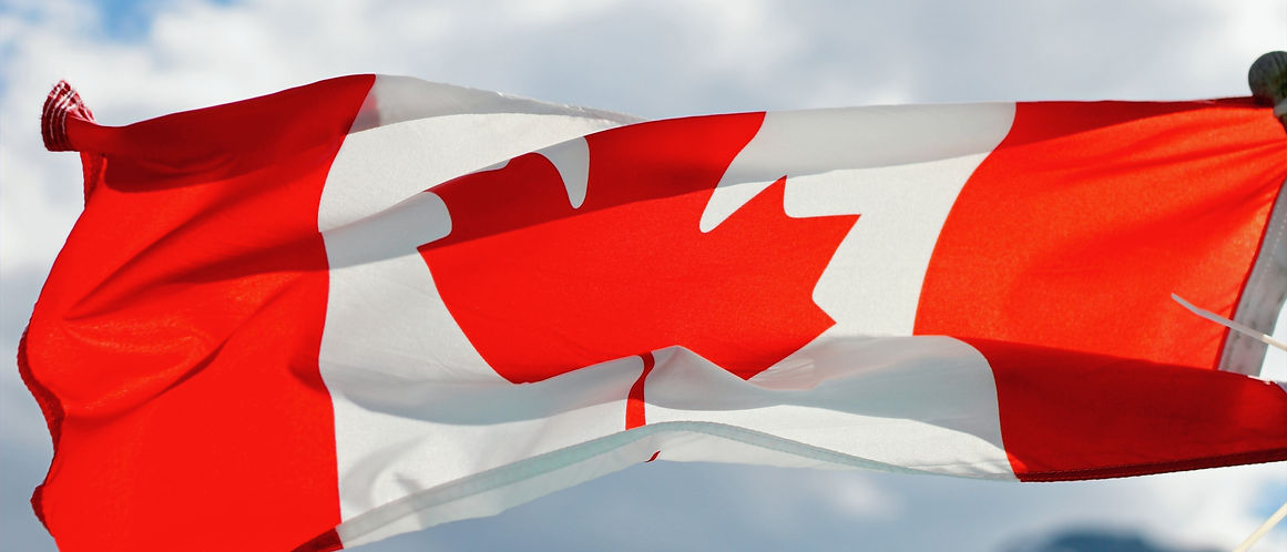 a red flag flying canada flag