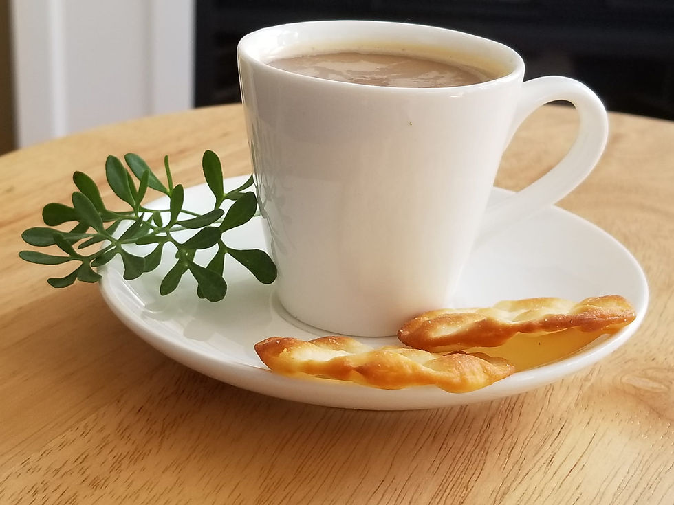 Thumbnail: a cup of ethiopian capuccino with a side of garden rue and snack bread stick