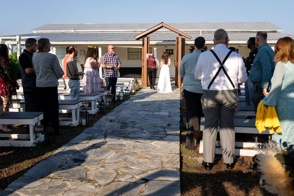 Wide view down the aisle at an outdoor wedding ceremony