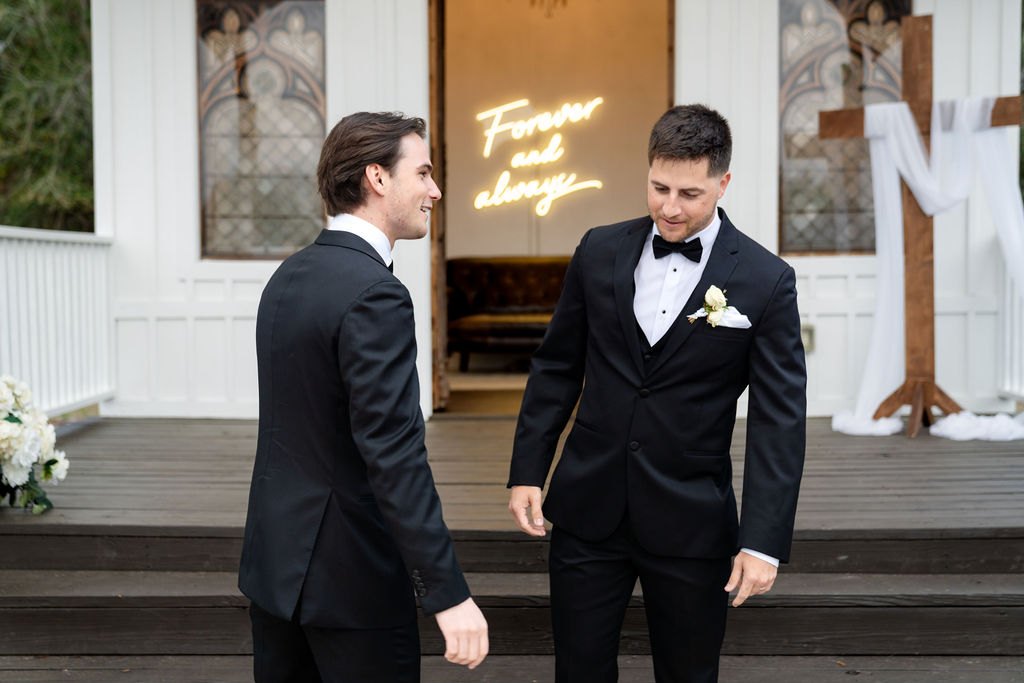 Groomsmen chatting outside the chapel before the wedding