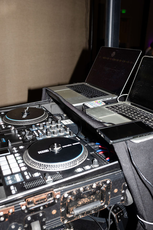 DJ mixer and laptop set up for a wedding reception