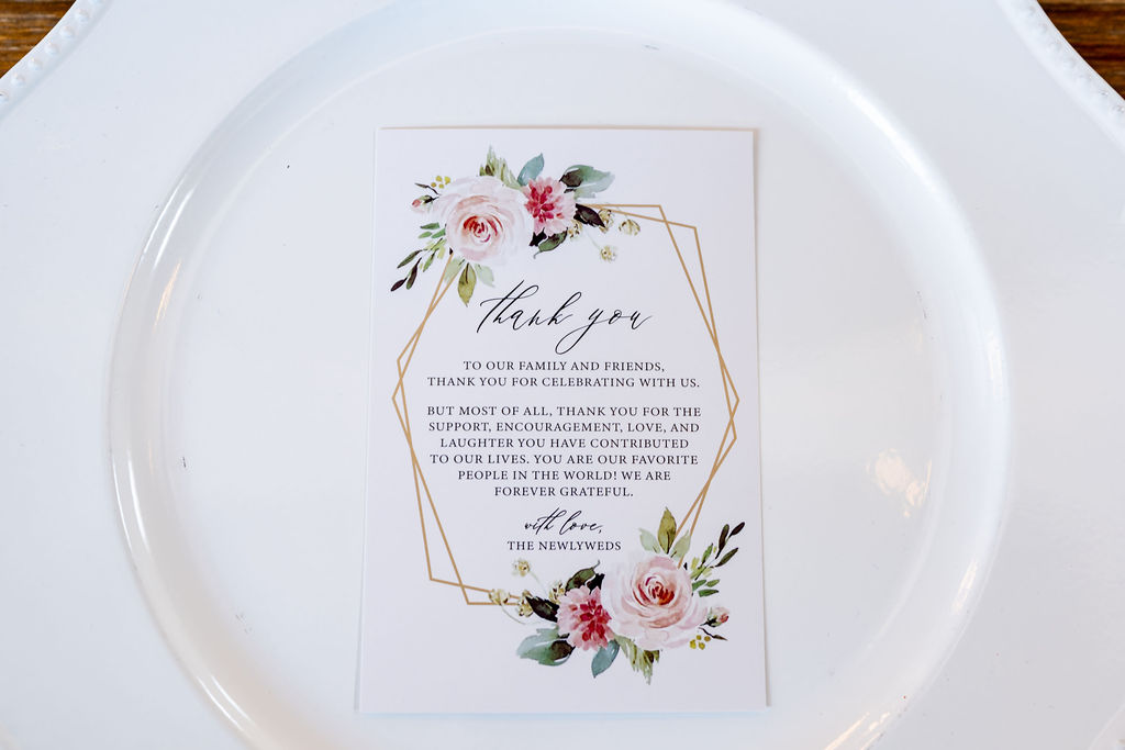 Floral thank-you card set on a white reception plate