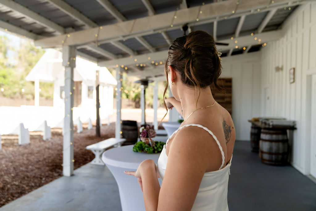 Bride holding her vows outdoors before the wedding