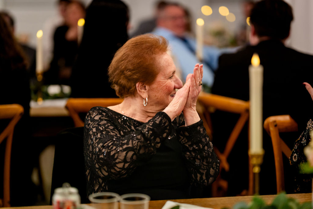 Adult guest reacting emotionally during wedding speeches