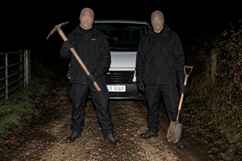 Masked Men Beside a Rural Van.png