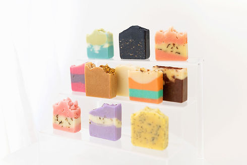 picture of all our soap in our collection on a stand