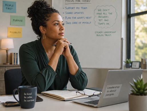 Leader contemplating at her desk.