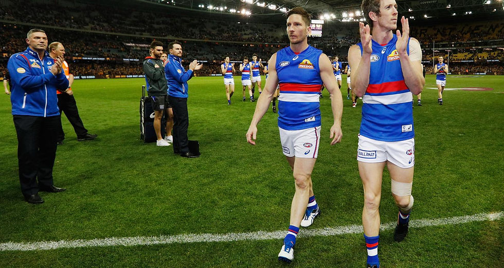 Matthew Boyd (L) and Robert Murphy of the Bulldogs waves to fans after losing their retirement match during round 23 AFL match between the Hawthorn Hawks and the Western Bulldogs at Etihad Stadium on August 25, 2017 in Melbourne, Australia. (Photo by Michael Dodge/Getty Images)
