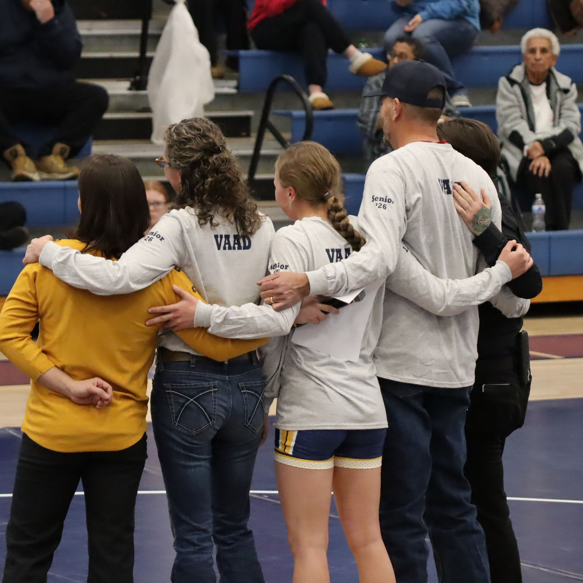 Kaycee Vaad with parents and coaches