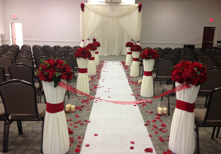 A wedding ceremony setup in the Grand Salon featuring a center aisle.