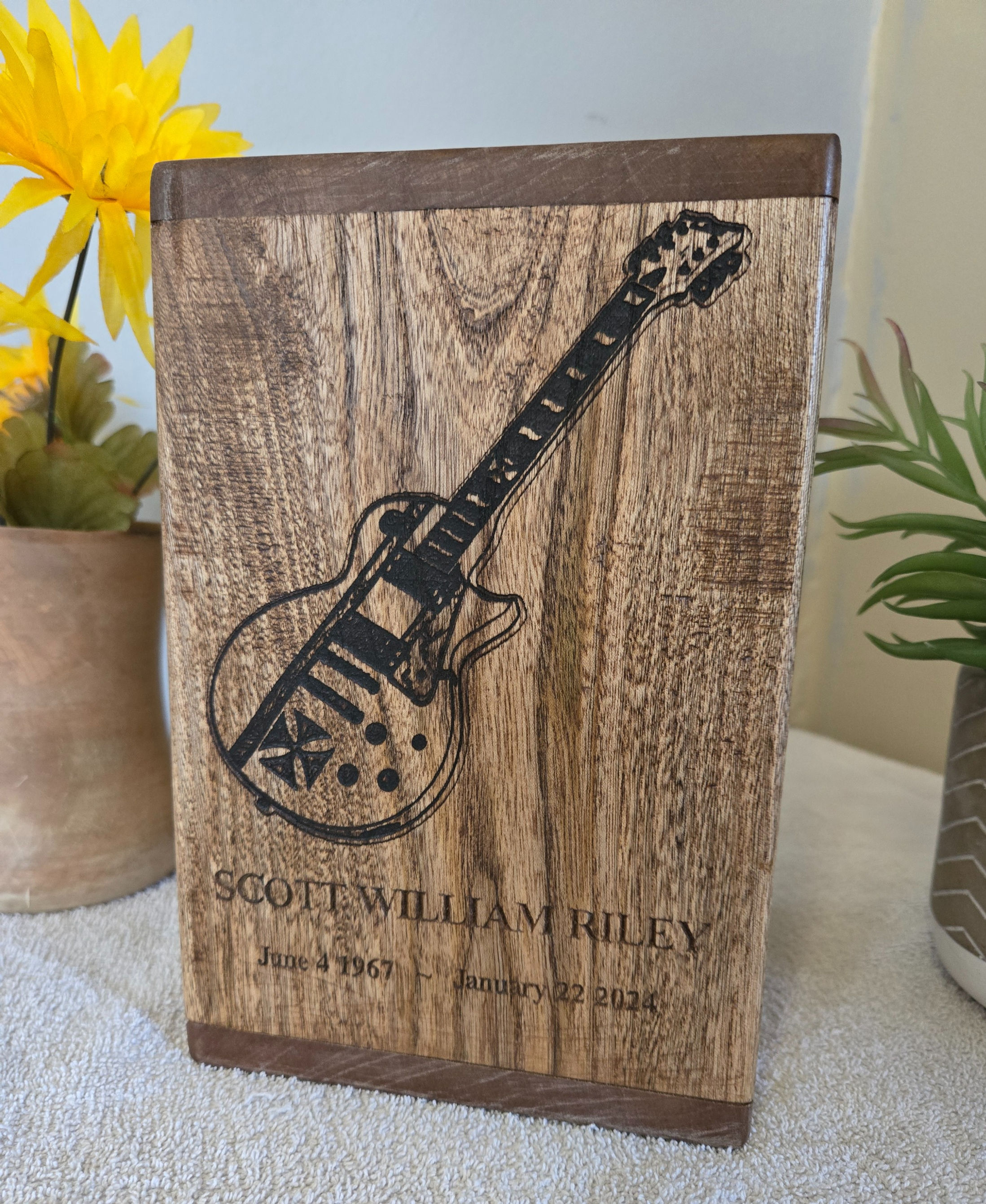 Cremation urn with carved inscription and laser engraved image