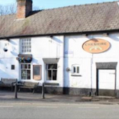 Cheshire pub exterior, white building with sign, sunny day, Warrington, The Dog Friendly Map