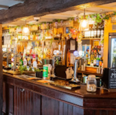 Interior view of a traditional pub bar, drinks Stratford upon Avon inside.