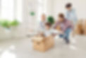Happy family couple with children on moving day having fun in new apartment riding son in