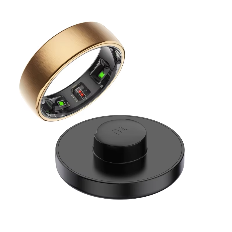 Thumbnail: Gold smart ring showing internal sensors above a black charging dock.