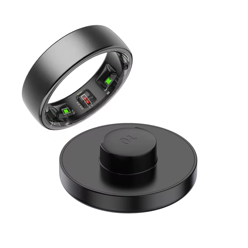Thumbnail: Black smart ring with internal sensors and charging dock