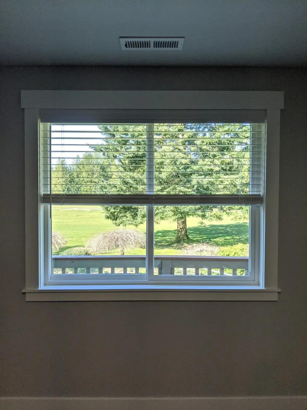 Faux wood blinds in a window.