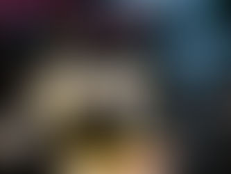 A variety of a bottle of wines, wine glasses, and a cheese plate.