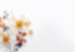 A beautiful bouquet of fresh spring colorful pastel and vivid flowers, flat lay on a white