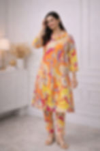 Woman wearing Printed Kurta Plazo set in a room with light Women Printed Kurta Plazo (Pant) Set – Rayon Fabric