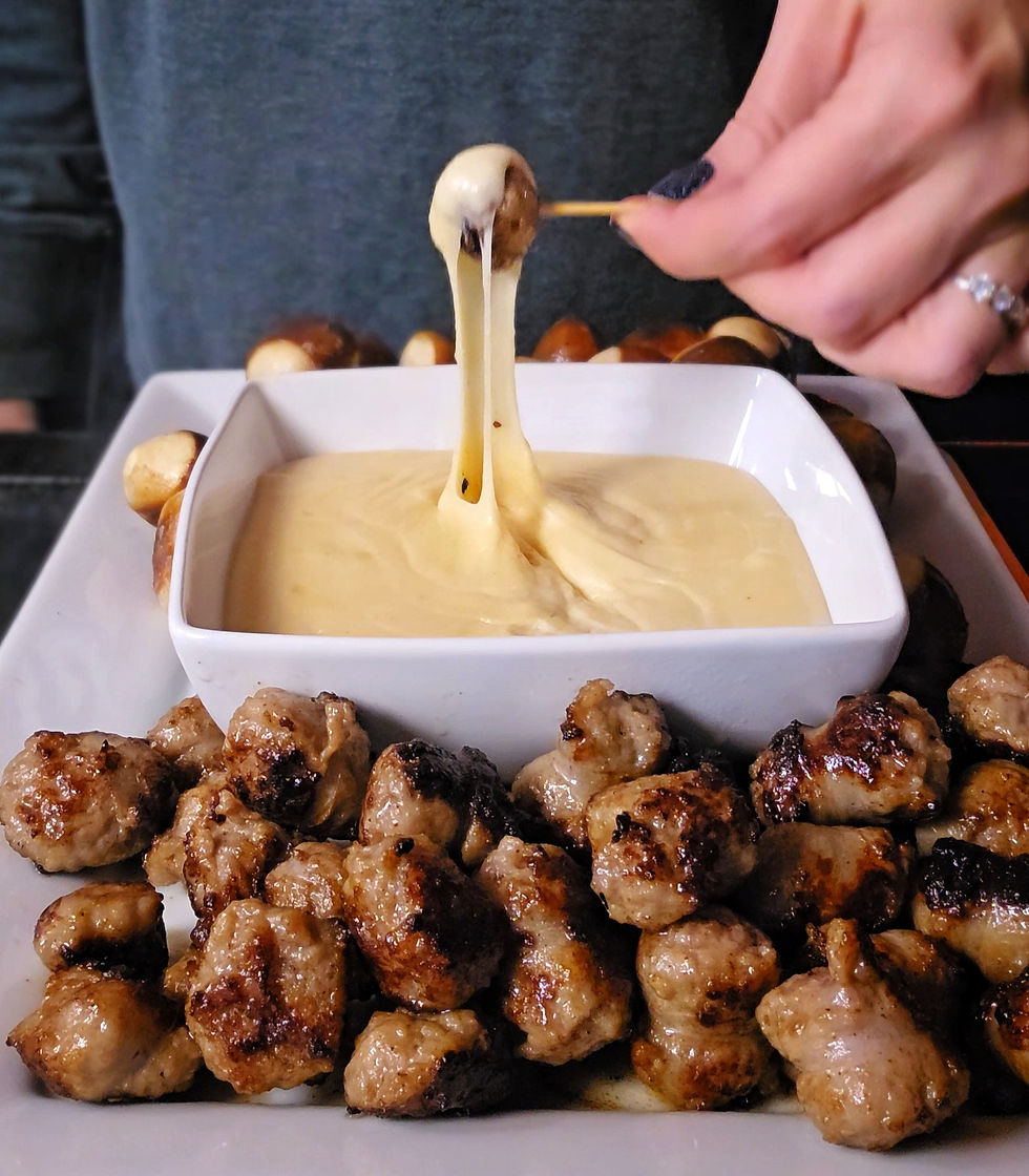 Beer cheese dip recipe cooked in a saucepan, ideal for camping, RV cooking, and tailgating.