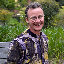 Jordan Bryon headshot garden.jpg