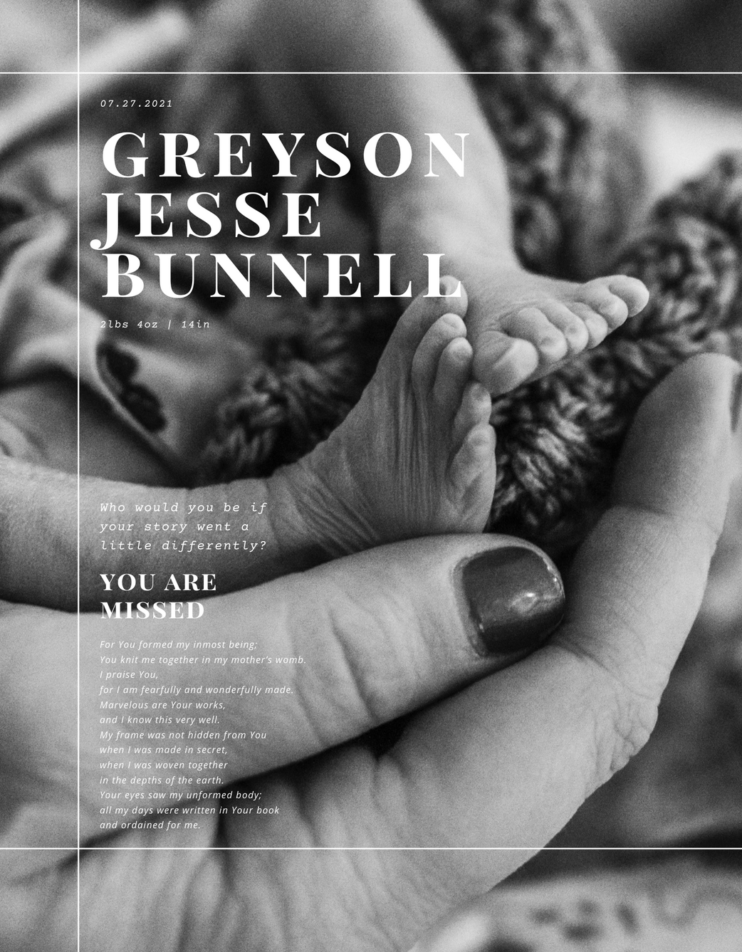 Bereaved mother holding the feet of her stillborn baby boy
