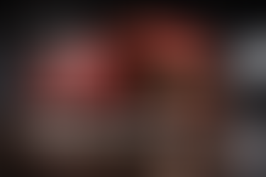 High-end cinematic image of a truck made of KitKat chocolate bars filled with packaged KitKat, displayed in a premium industrial warehouse