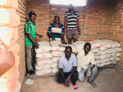 School receiving bags of cement