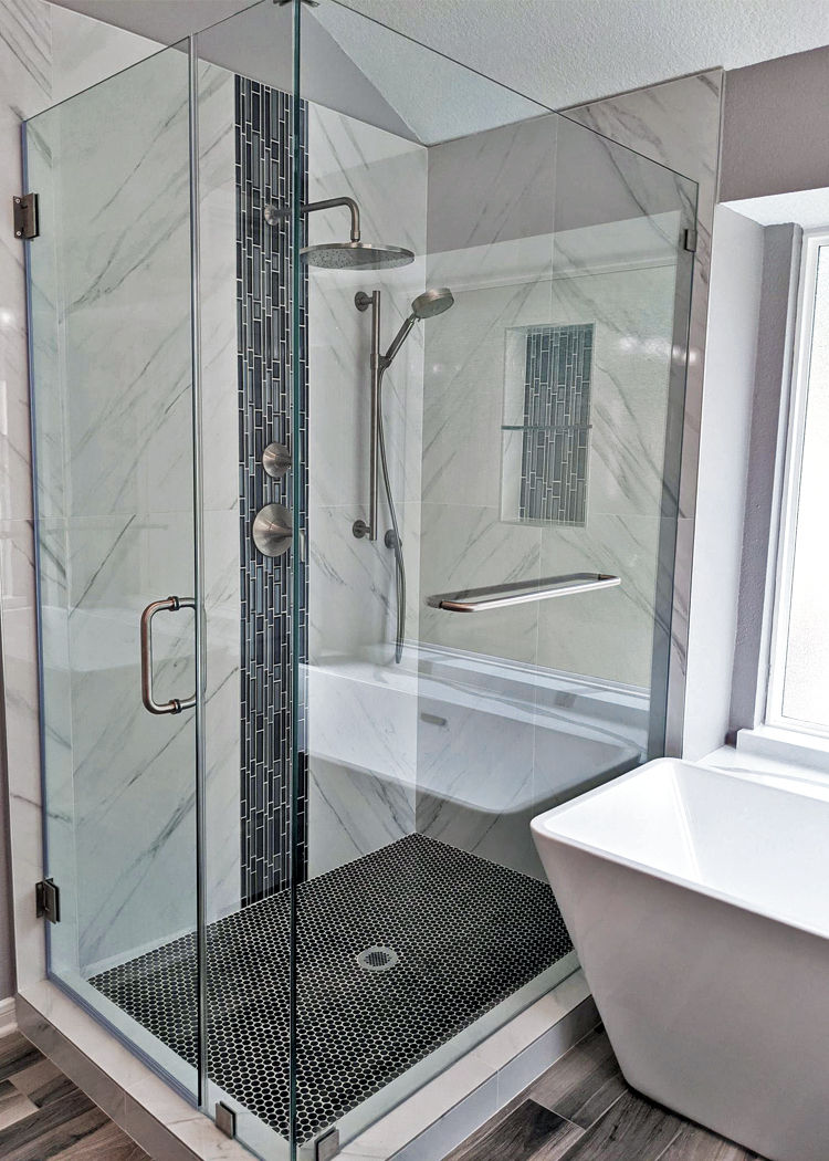 Frameless glass shower door surround with towel bar