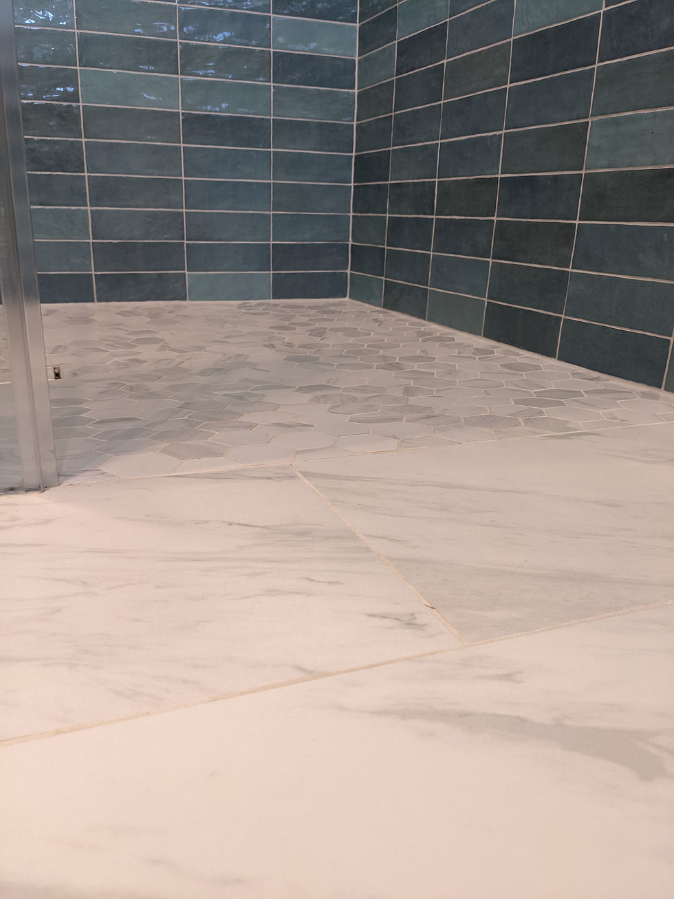 Curbless shower which helps prevent any accidents like tripping or falling over.