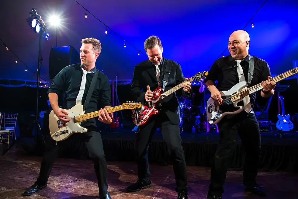 Live band performing on stage at historic Austin music venue with professional lighting and formal attire