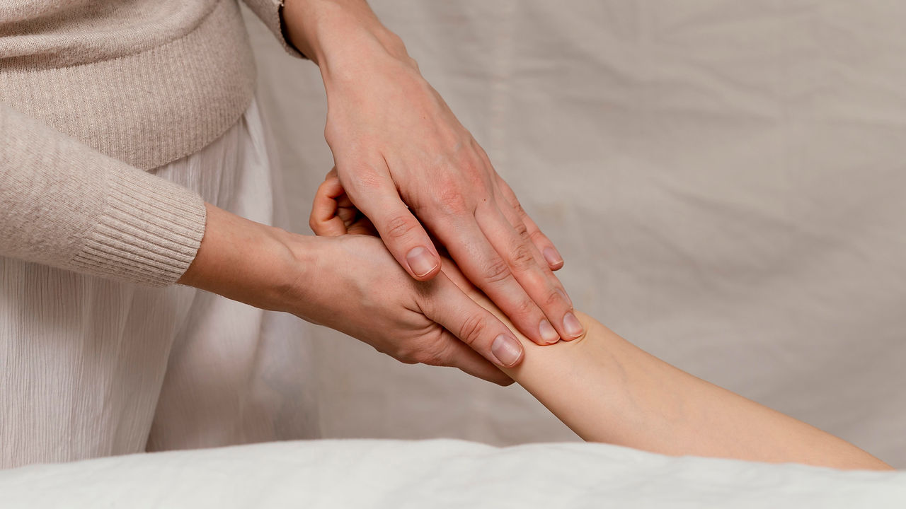 close-up-therapist-massaging-hand.jpg