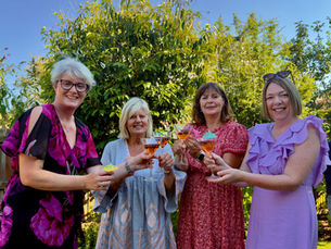 Four woment celebrating 