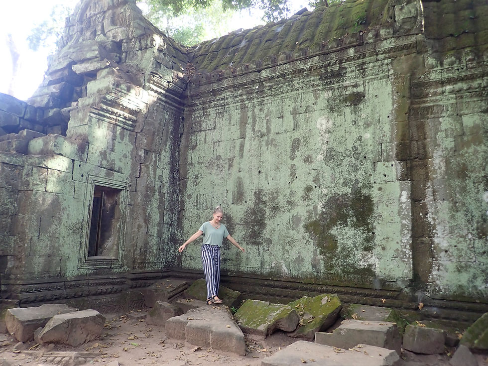 Amanda exploring Angkor Wat in Cambodia during extended travels through Southeast Asia