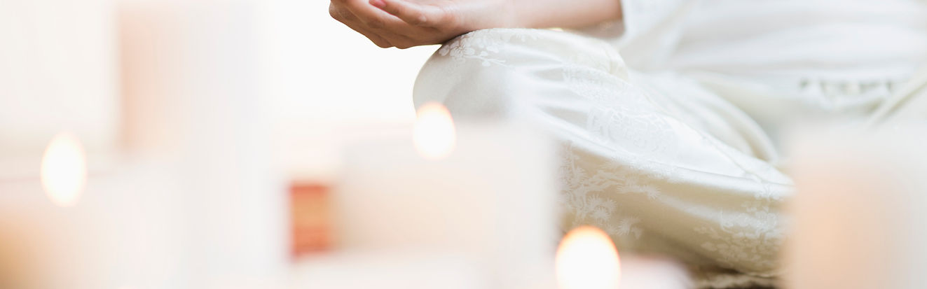 person sitting in a meditative position