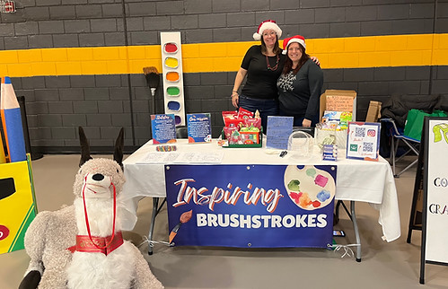 Our President and Treasurer wearing Santa hats at a fundraising event in Millersville.