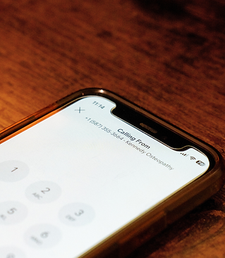 Cell phone showing a call is coming from Kennedy Osteopathy.