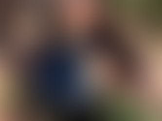 Goddess Becky in black rainbow PVC bodysuit and trousers from Pairadize Clothing, symbolising style and elegance in psychological femdom, feminine leadership, and controlled power.