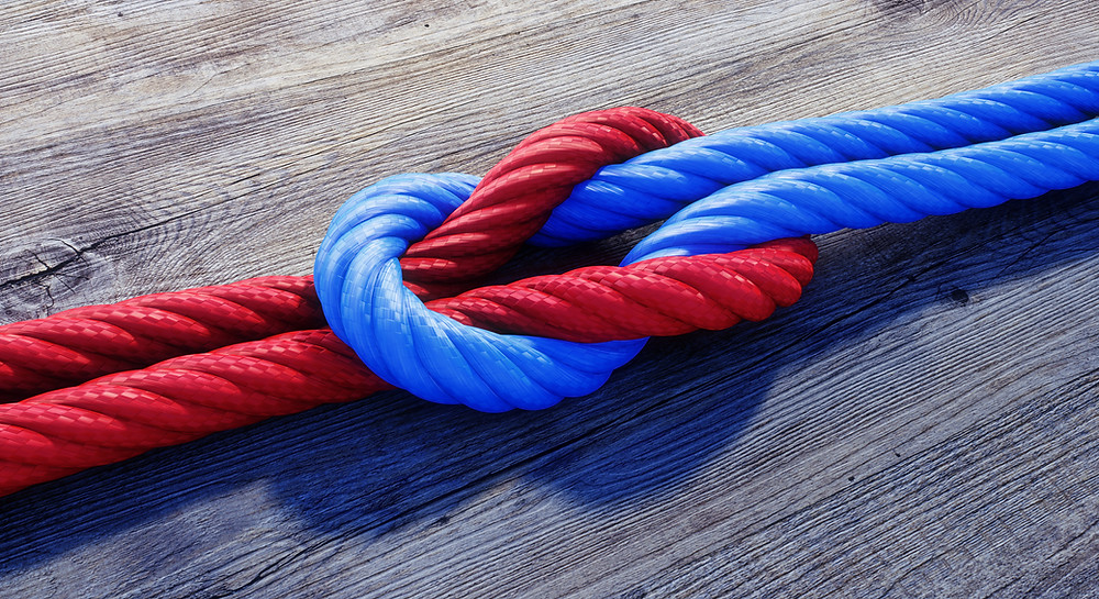 Two ropes tied in a knot to symbolise cooperation