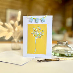 A handmade mother's day card, with a 'Mum' banner.